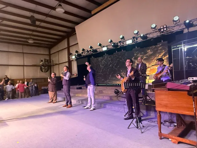 Worship leaders and musicians serving on the ARISE camp stage.